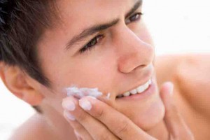 Man putting on shaving cream smiling